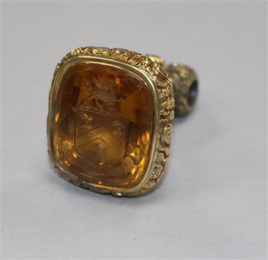 A large pinchbeck fob seal with coat of arms engraved citrine matrix
